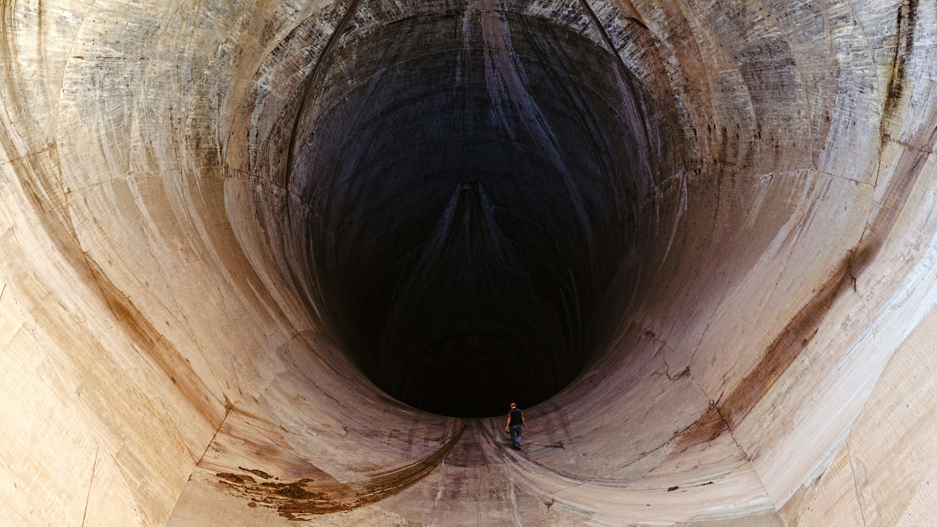 man inside tunnel during daytime